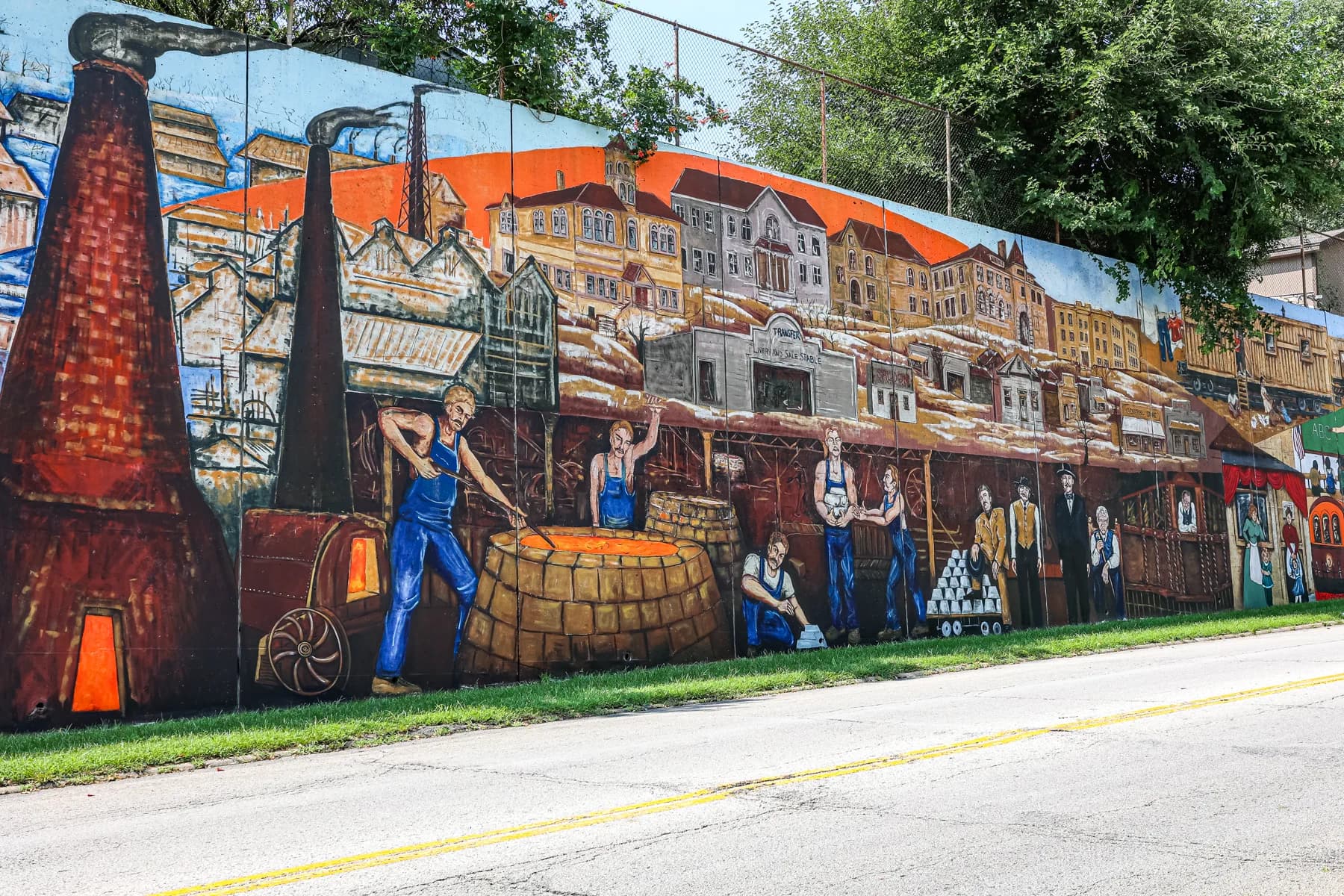 A section of the Argentine mural depicting the neighborhood's industrial history