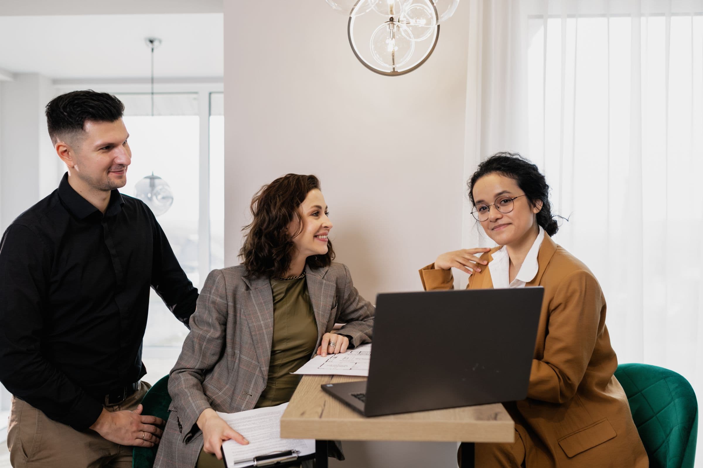 A family meeting at a table to discuss buying a home